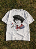 Le D Note – White Tee – flat-lay | Meme Tees